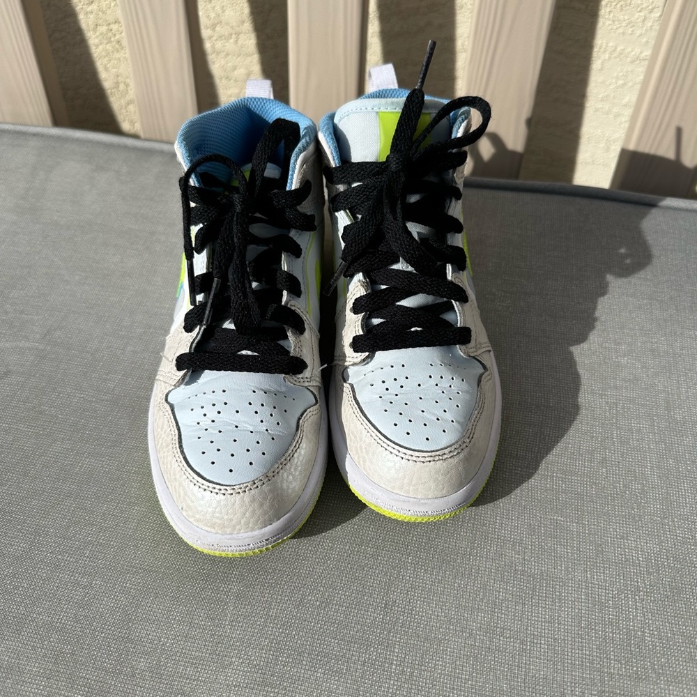 Nike Jordan 1s neon, white and blue.